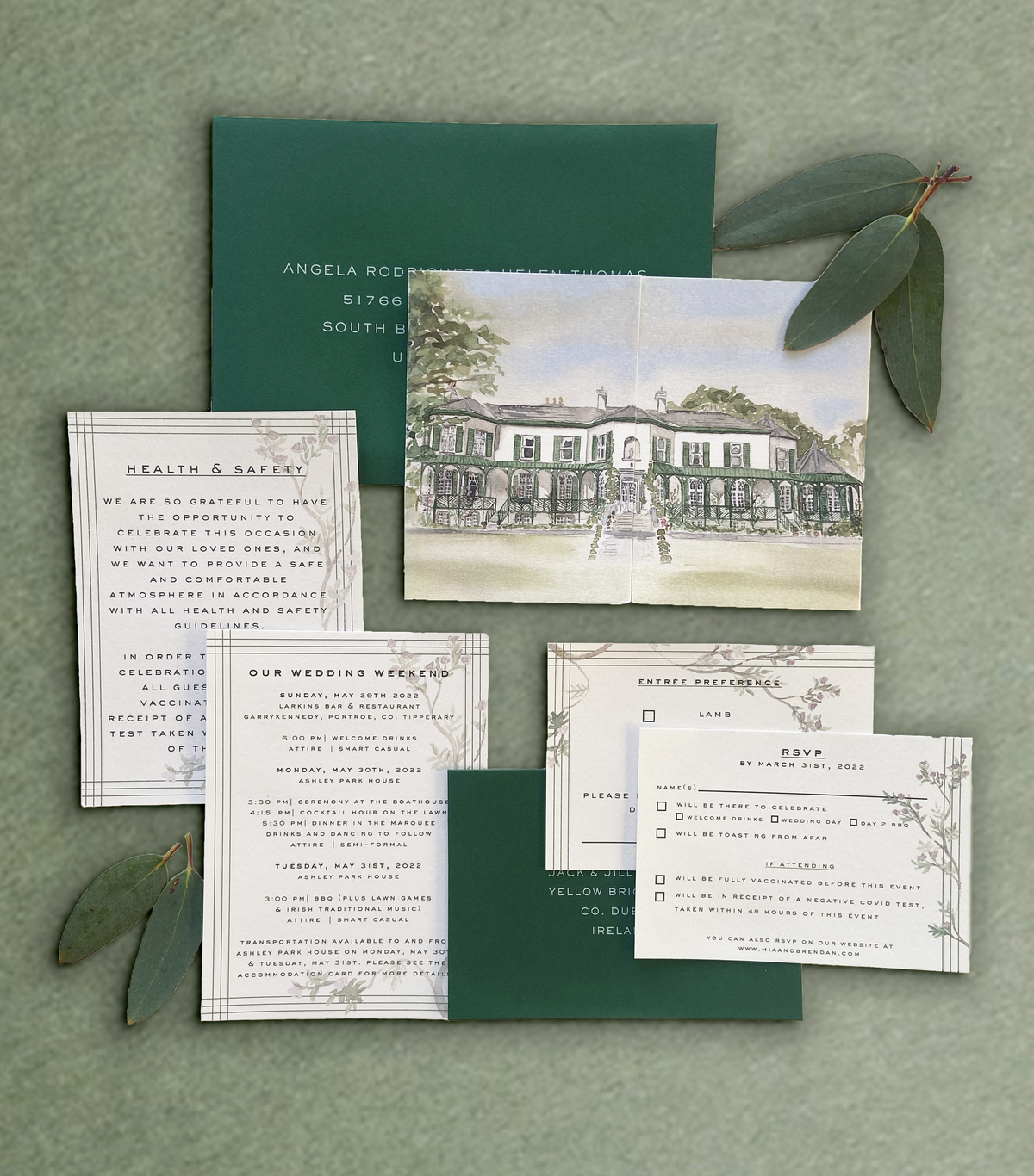A wedding invitation suite featuring a gatefold invitation with a watercolour illustration of Ashley Park House, and details card with watercolour detailing paired with a forest green envelope, by Hannah Blake Art