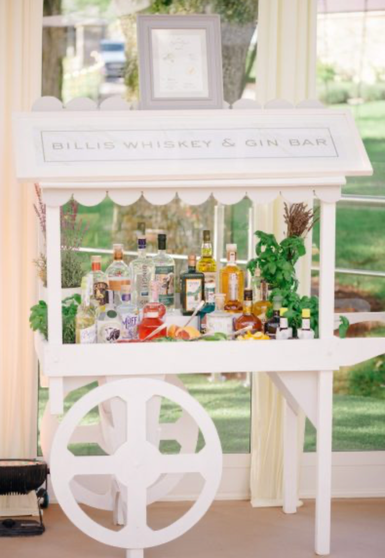 Bespoke whiskey and gin bar sign at garden wedding by Hannah Blake Art