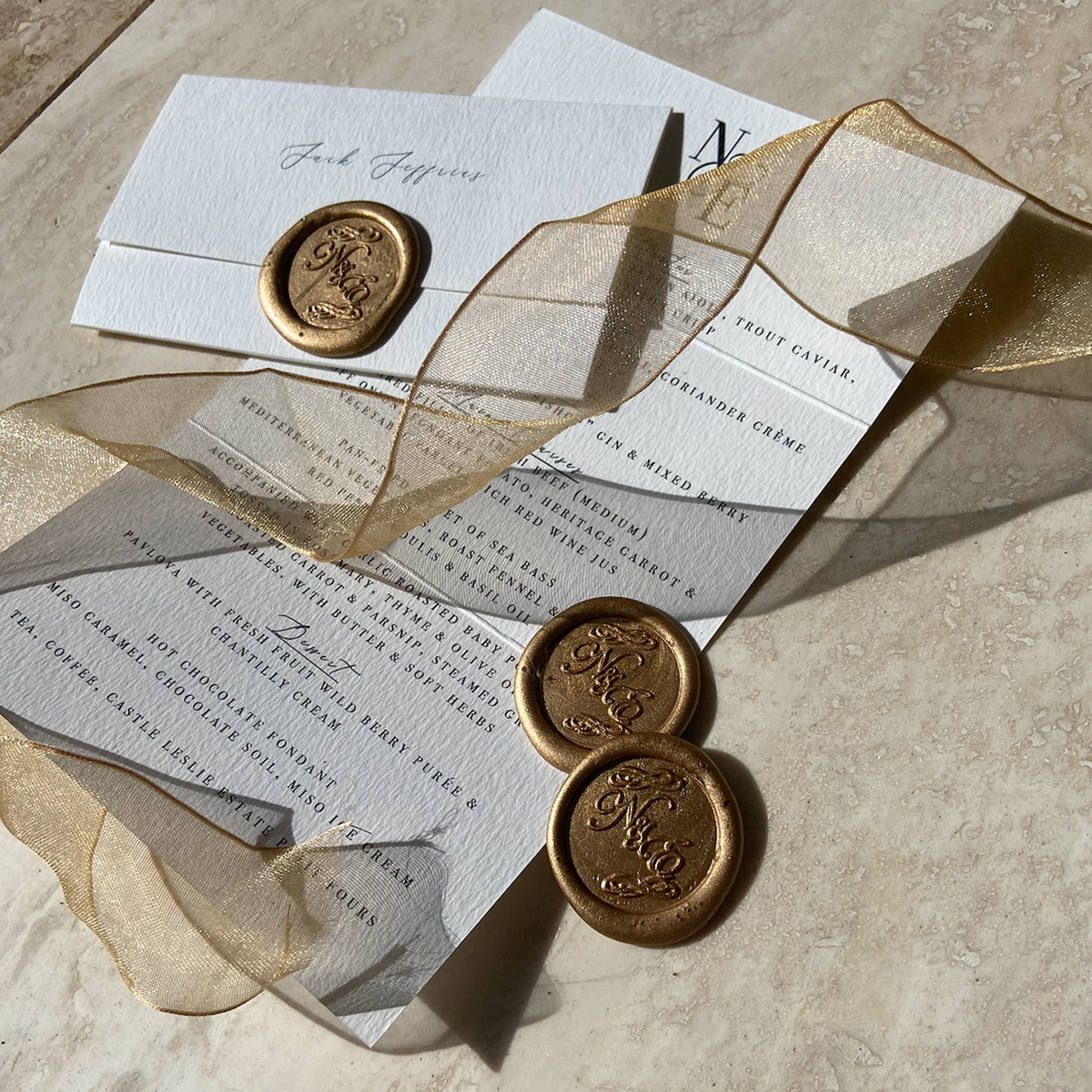 Nicola & Enda's Place Card Fold Out Menu finished with a Monogrammed Gold Wax Seal
