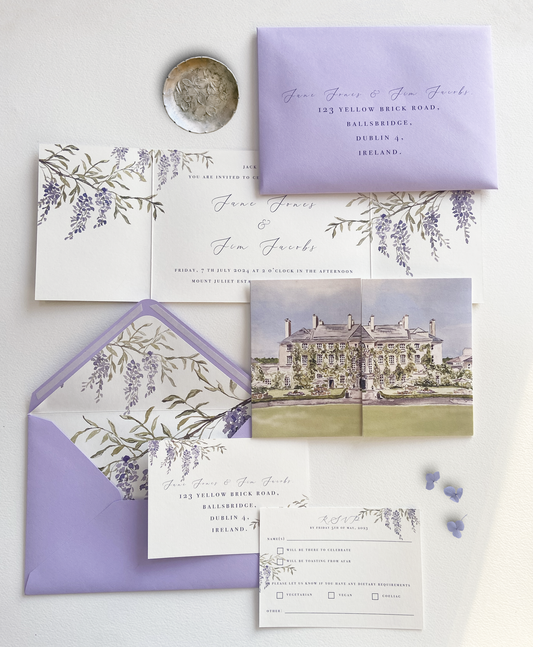 A wedding invitation suite featuring a gatefold invitation with a watercolour illustration of Mount Juliet Estate paired with a lavender envelope, by Hannah Blake Art