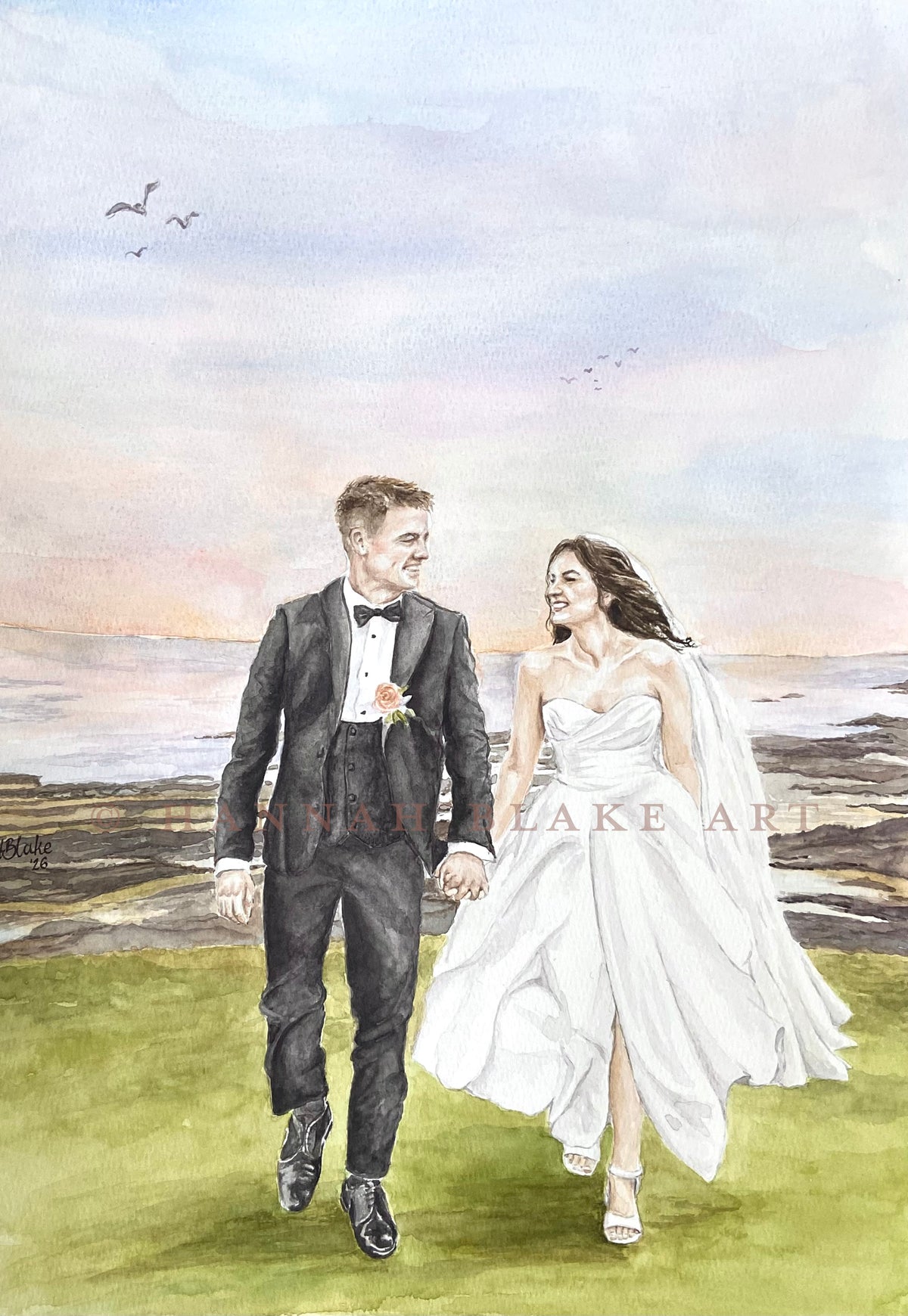 Watercolor wedding portrait of a bride in a white gown and groom in a black tuxedo walking hand in hand on a grassy field by the water, with a pale sky and birds in the background.